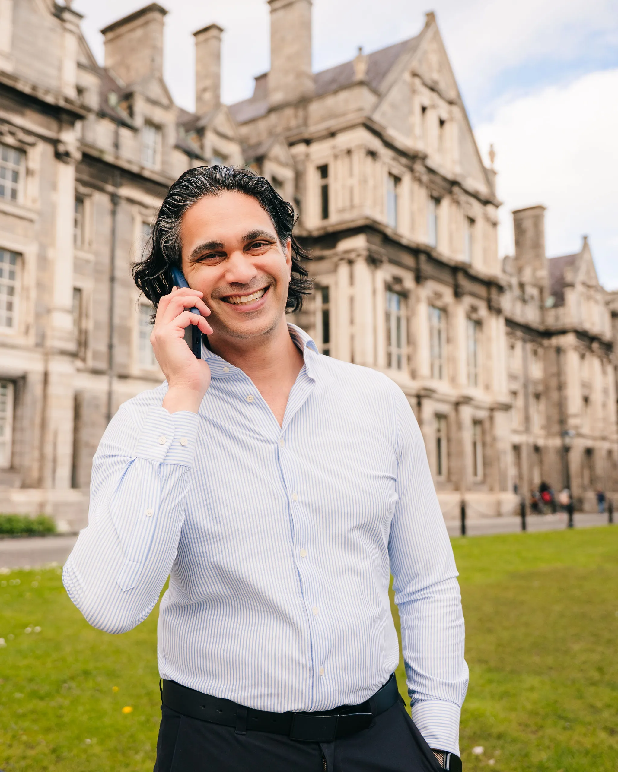 Aaron Rodericks taking a call outside Trinity College Dublin